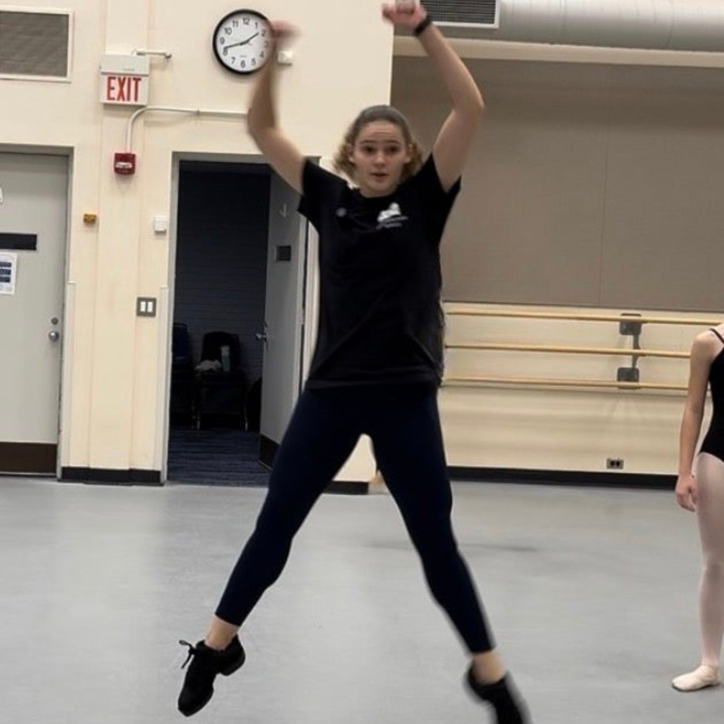 Teacher demonstrating jump for a ballet class at UNCSA